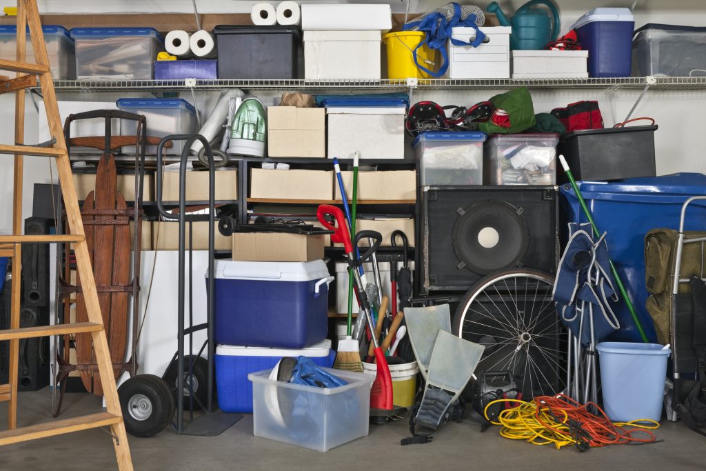 Overloaded garage. Boxes, coolers, sporting gear and more.